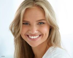 Blond Female With Wide White Smile