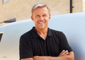 Mature Male Smiling with Arms Folded