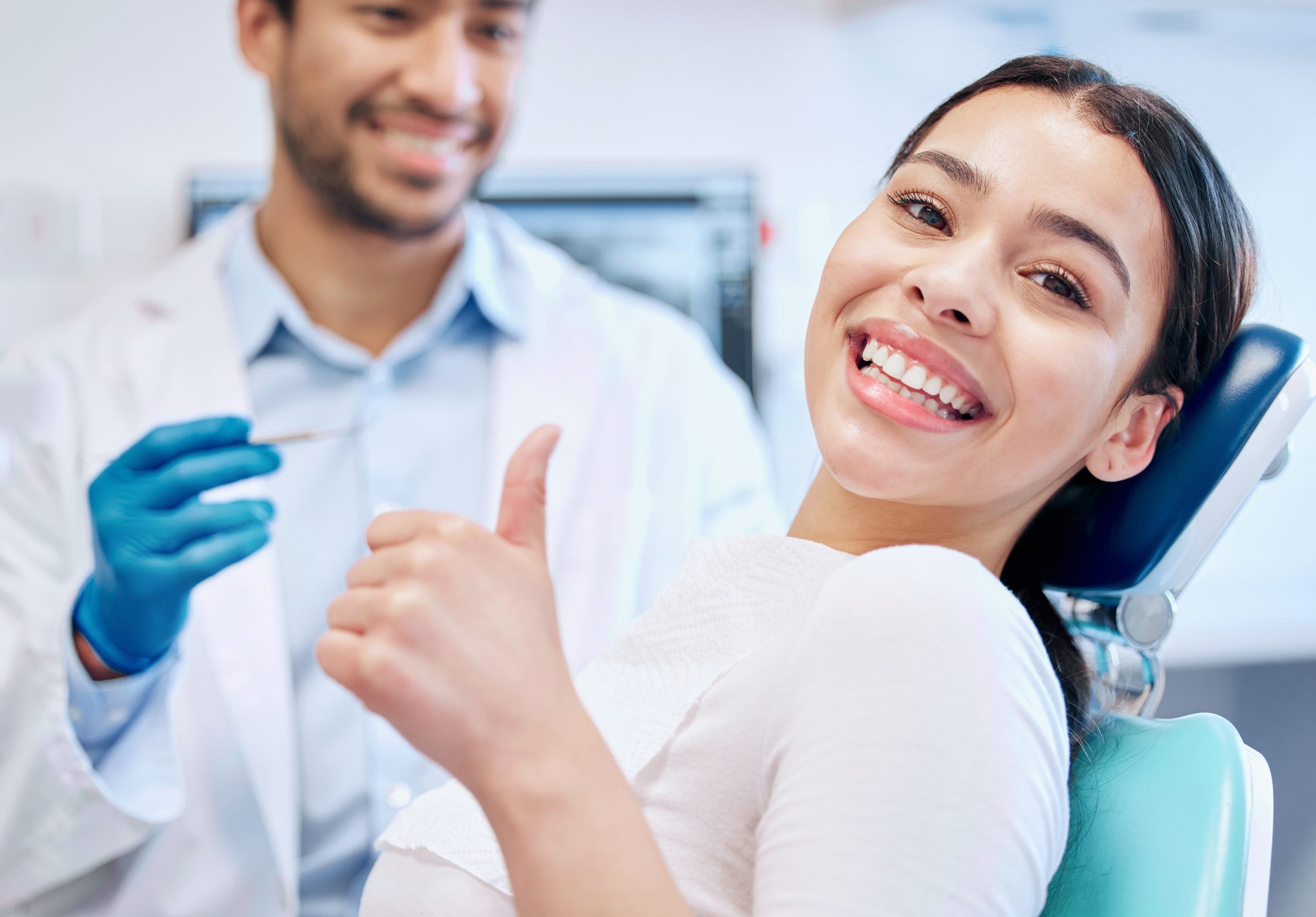 Female Tooth Extraction Patient Thumbs Up